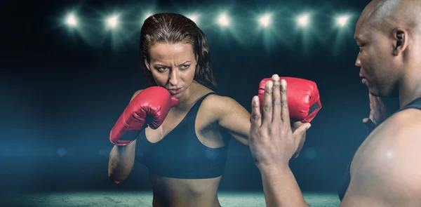 Female boxer practicing with trainer — Stock Photo, Image