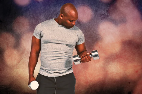 Fit man exercising with dumbbell — Stock Photo, Image