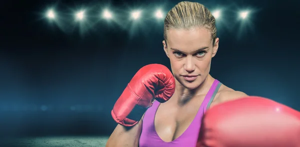 Portrait of female boxer with fighting stance — Stock Photo, Image
