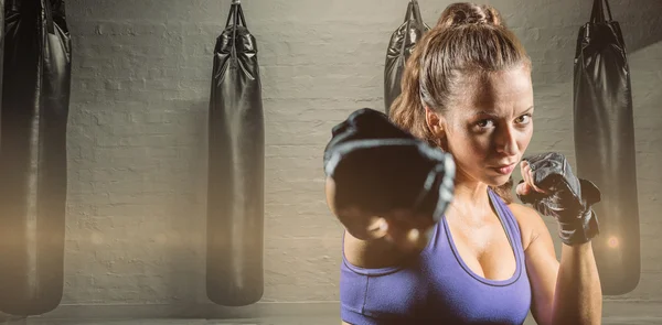 Portrait of female fighter punching — Stock Photo, Image
