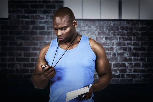 Fit trainer checking his stopwatch — Stock Photo, Image