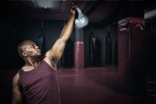 Fit man exercising with dumbbell — Stock Photo, Image