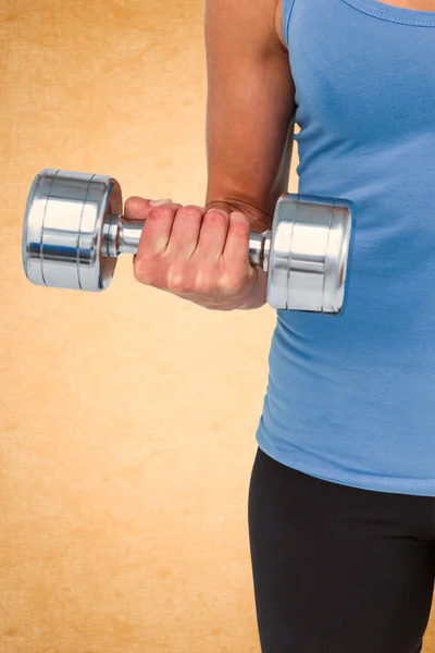 Muscular woman exercising with dumbbells — Stock Photo, Image