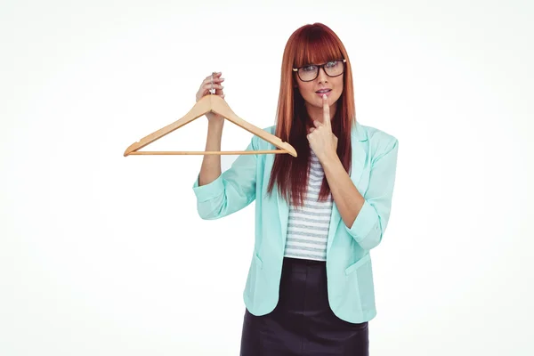 Hipster woman holding clothes hanger — Stock Photo, Image