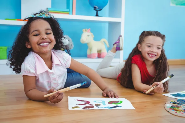 Cute girls painting letters — Stock Photo, Image