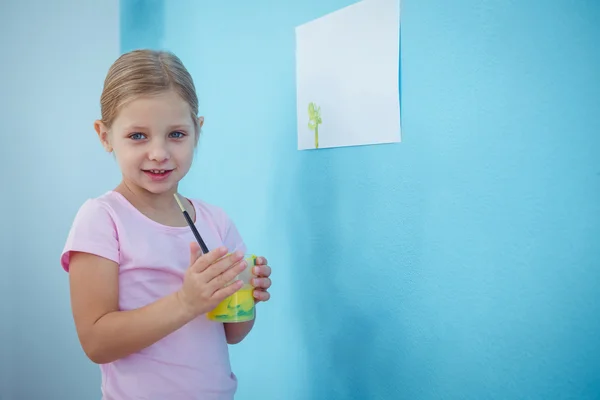 Cute girl holding glass with paint — Stock Photo, Image