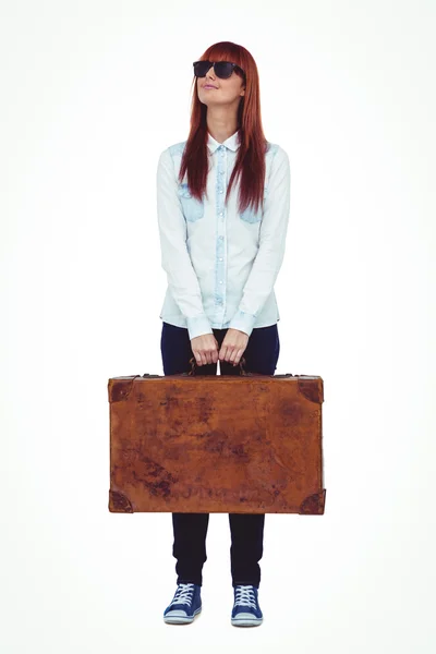Smiling hipster woman holding suitcase — Stock Photo, Image