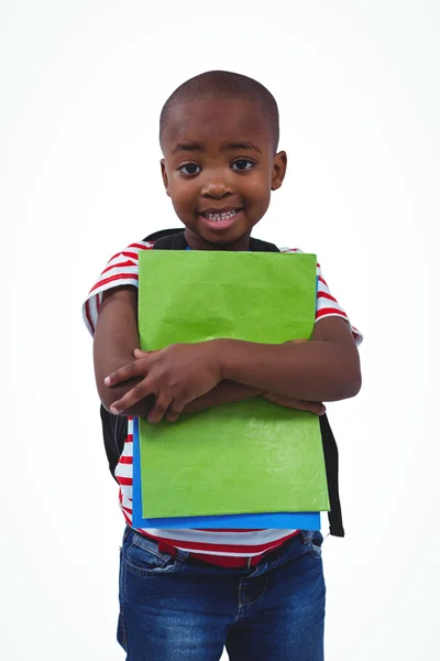 Standing boy with backpack holding notebooks — Stock Photo, Image