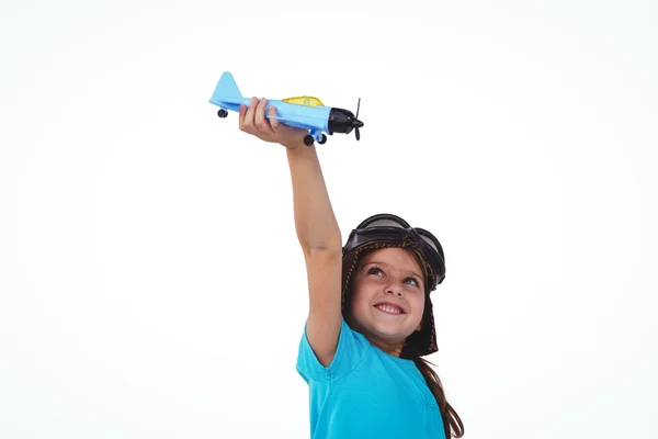 Smiling girl playing with toy airplane — Stock Photo, Image