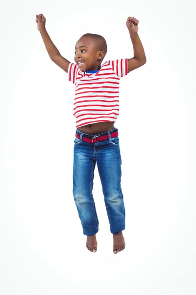 Smiling boy jumping — Stock Photo, Image