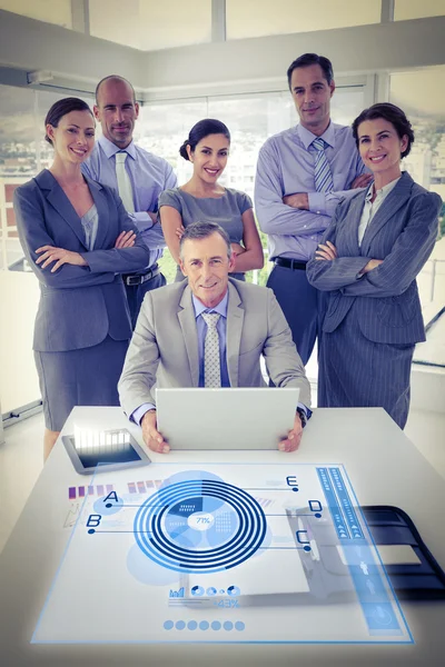 Pie chart against business team — Stock Photo, Image