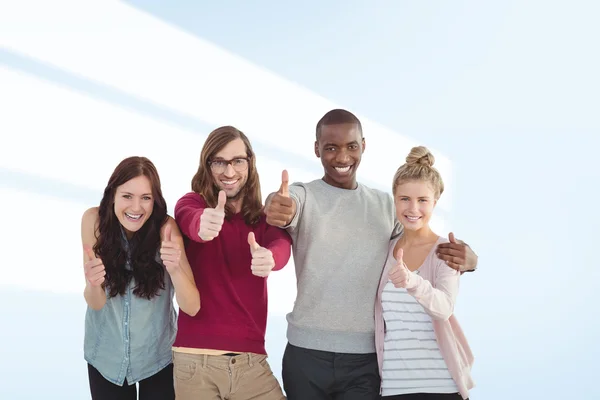 Smiling business team with thumbs up — Stock Photo, Image