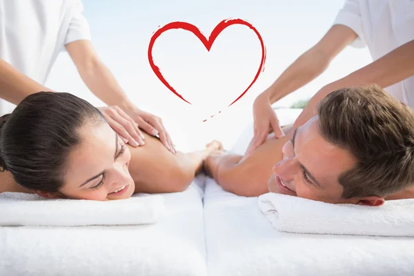 Casal tranquilo desfrutando de casais massagem piscina — Fotografia de Stock