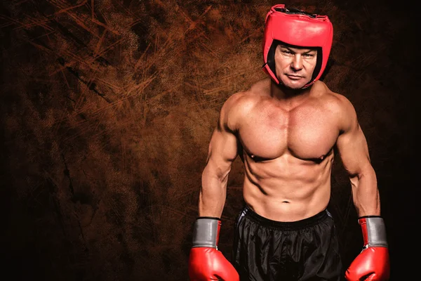 Portrait of shirtless man with boxing headgea — Stock Photo, Image