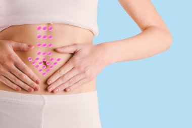 slim woman touching her belly clipart