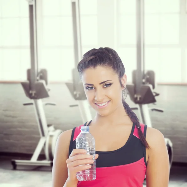 Fit woman holding water bottle — Stock Photo, Image