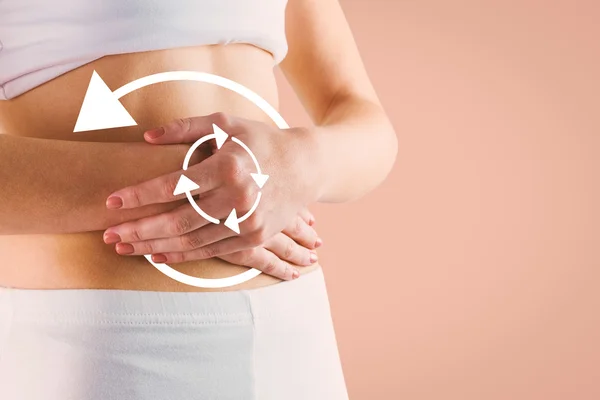 Slim woman touching her belly — Stock Photo, Image