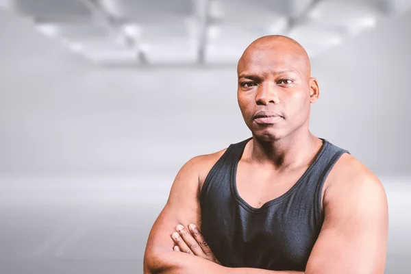 Portrait of bald bodybuilder with arms crossed — Stock Photo, Image