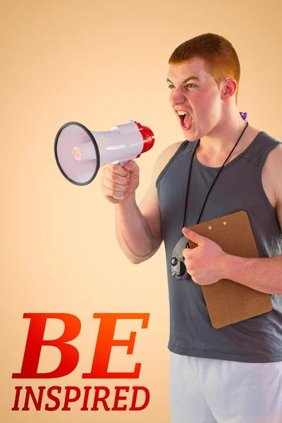 Angry personal trainer yelling through megaphone — Stock Photo, Image