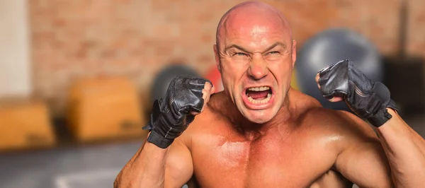 Angry fighter with gloves Stock Picture