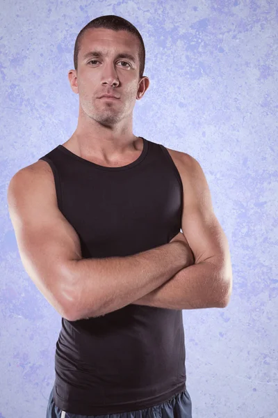 Confident athlete with arms crossed — Stock Photo, Image