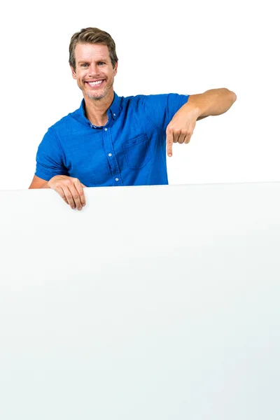 Smiling man holding board — Stock Photo, Image