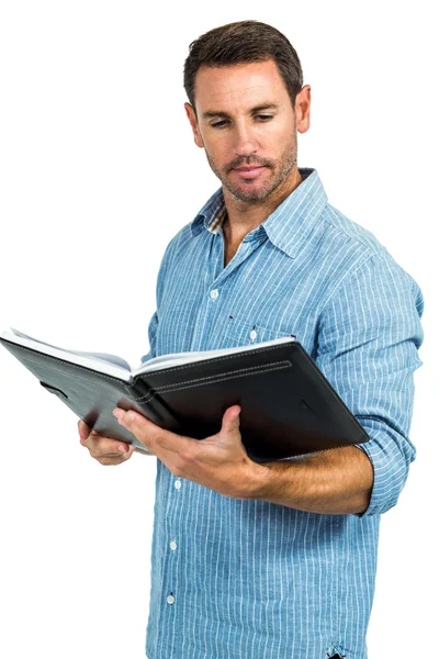 Handsome man reading book — Stock Photo, Image