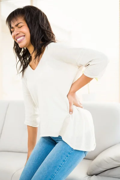 Pretty woman with back pain — Stock Photo, Image