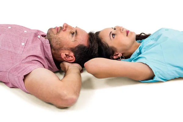 Couple relaxing on floor with hands — Stock Photo, Image