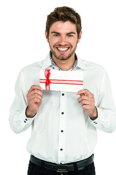 Handsome man holding gift box — Stock Photo, Image