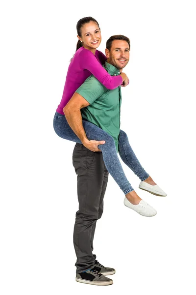 Sonriente pareja dando cerdito espalda — Foto de Stock