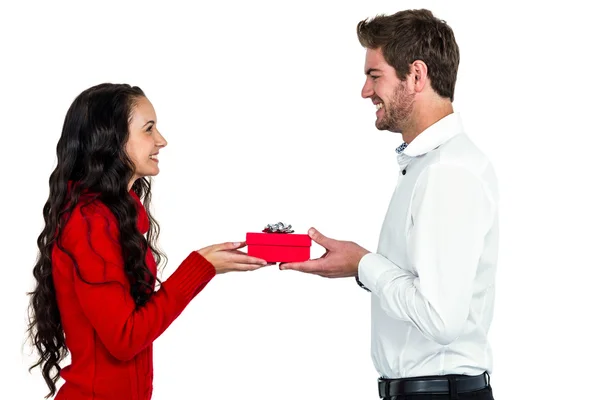 Excited young couple holding gift box — Stock Photo, Image