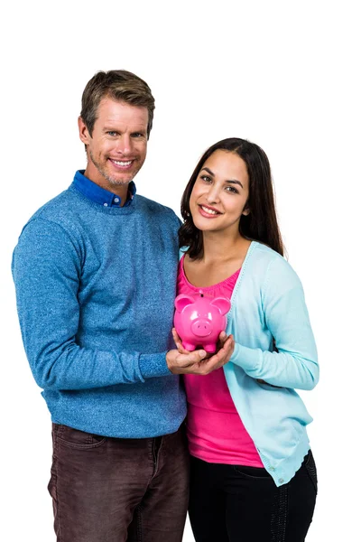 Portret van paar bedrijf piggy bank — Stockfoto