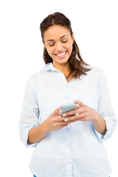 Smiling casual woman text messaging — Stock Photo, Image