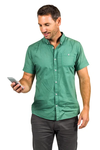 Smiling man using smartphone — Stock Photo, Image