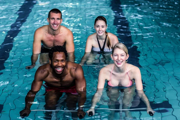 Fit people cycling in the pool — Stock Photo, Image