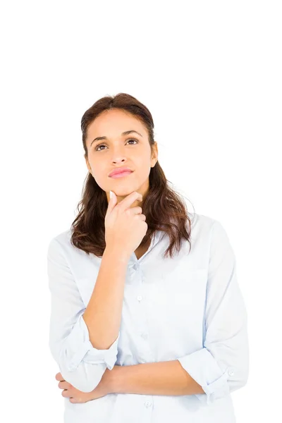 Doordachte vrouw met vinger op kin — Stockfoto