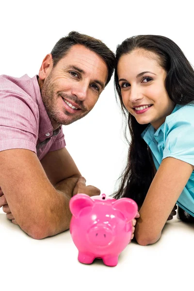 Smiling couple laying on the floor face to face — Stock Photo, Image