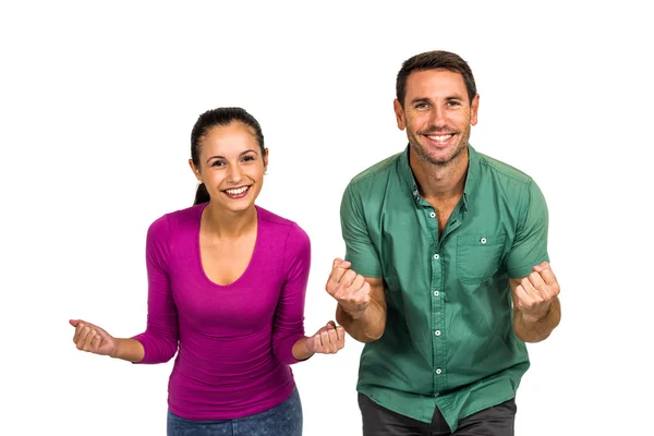 Triumphant couple raising fists — Stock Photo, Image