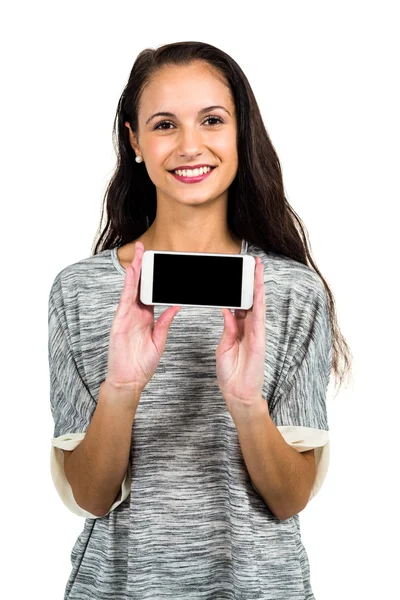 Femme souriante montrant smartphone — Photo