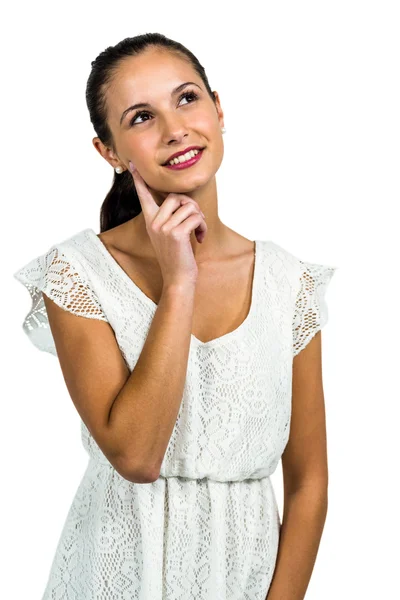 Young thoughtful woman with finger on cheek — Stock Photo, Image