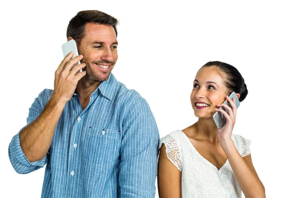 Smiling couple on phone call — Stock Photo, Image