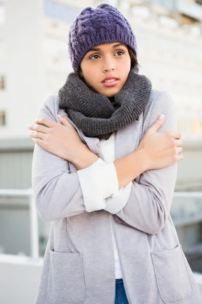 Thoughtful woman in winter coat trembling — Stock Photo, Image