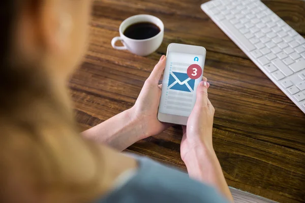 Imagen compuesta de mujer usando smartphone — Foto de Stock