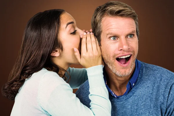 Woman whispering secret with man — Stock Photo, Image