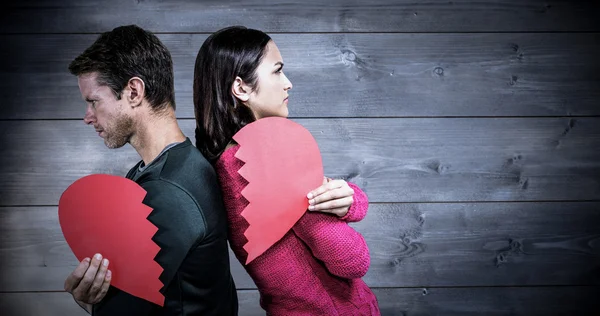 Allvarliga par stå rygg mot rygg — Stockfoto
