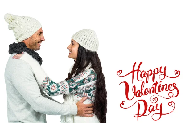 Smiling couple holding red heart shape — Stock Photo, Image