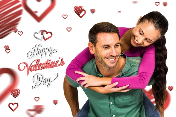 Smiling couple holding red heart shape — Stock Photo, Image