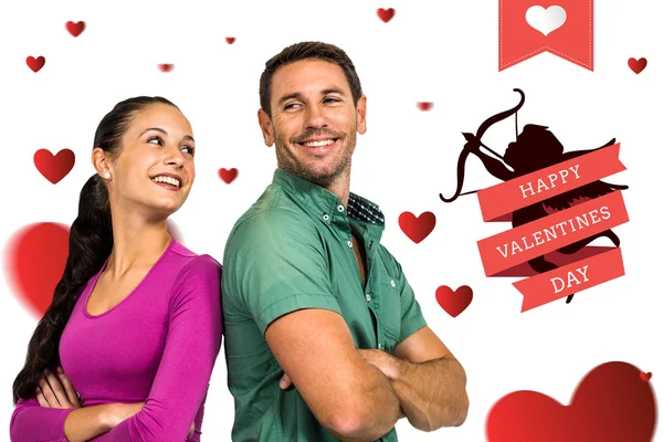 Smiling couple holding red heart shape — Stock Photo, Image