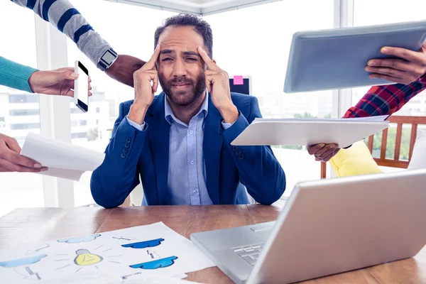 Stressful businessman by colleagues — Stock Photo, Image